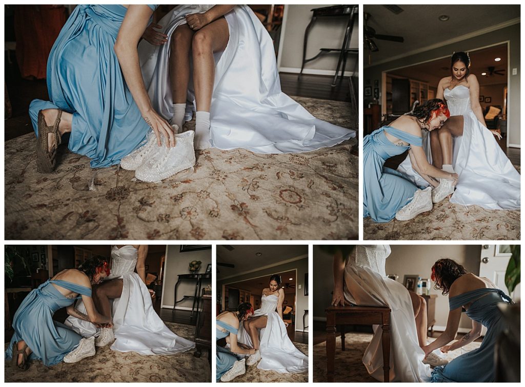 Maid of honor putting on brides shoes 