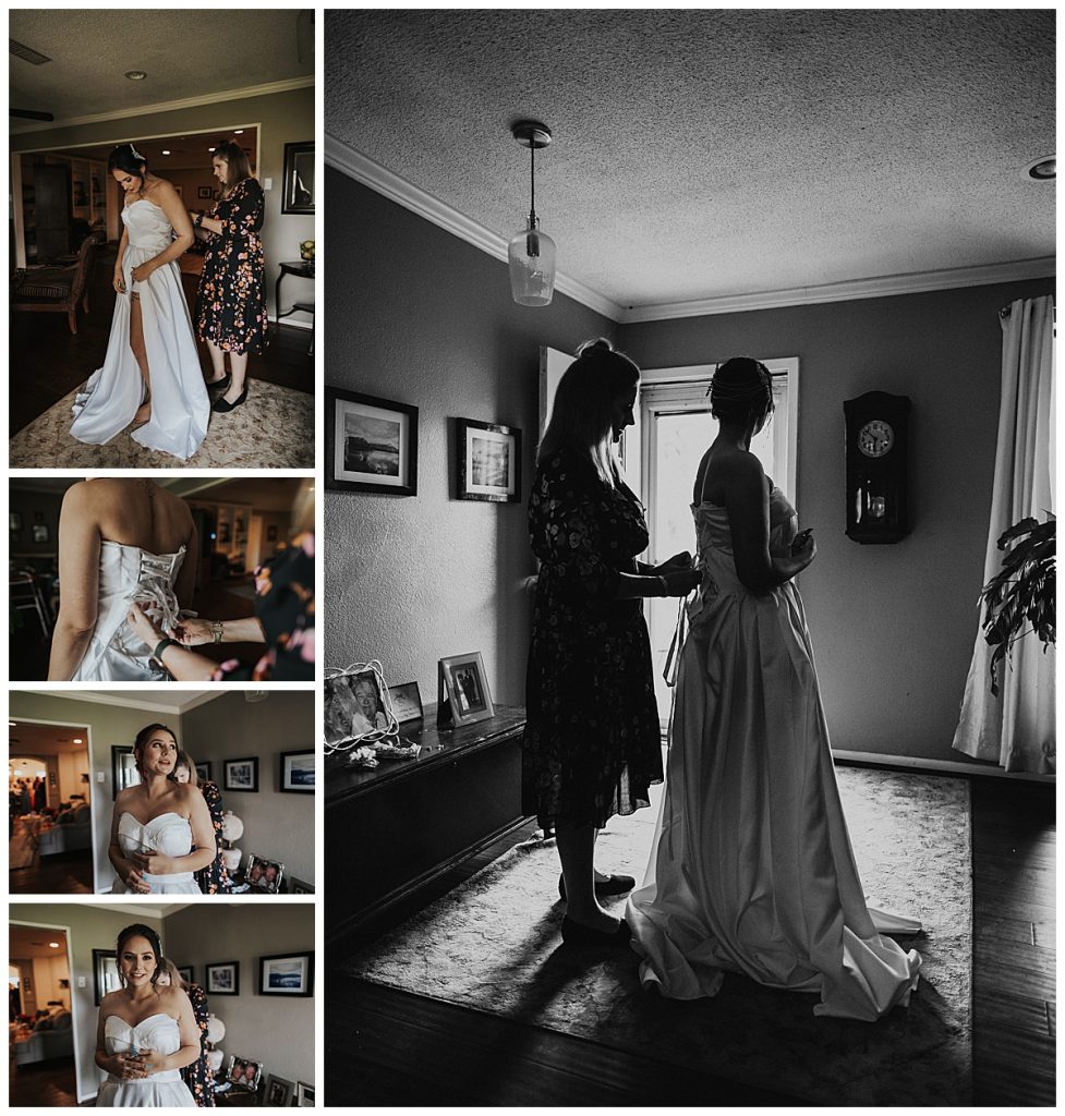 Bride getting into her dress being helped by her mother